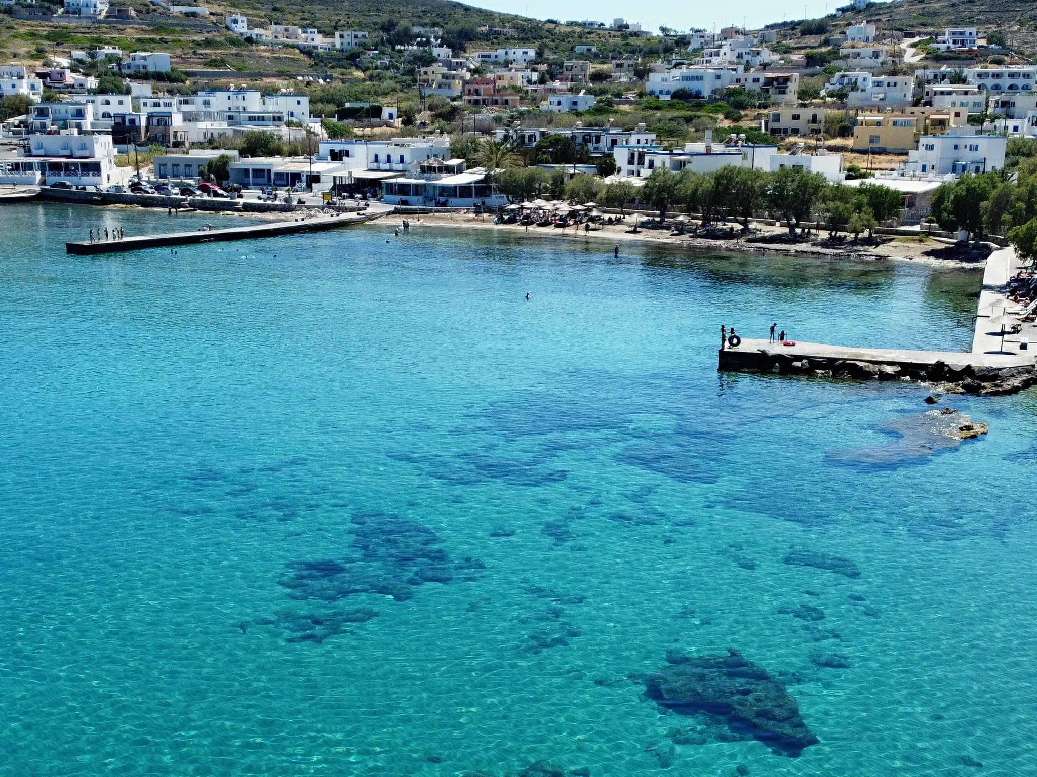 Azolimnos from above: the sandy bay, the tavernas along the beach and the village on the hill behind