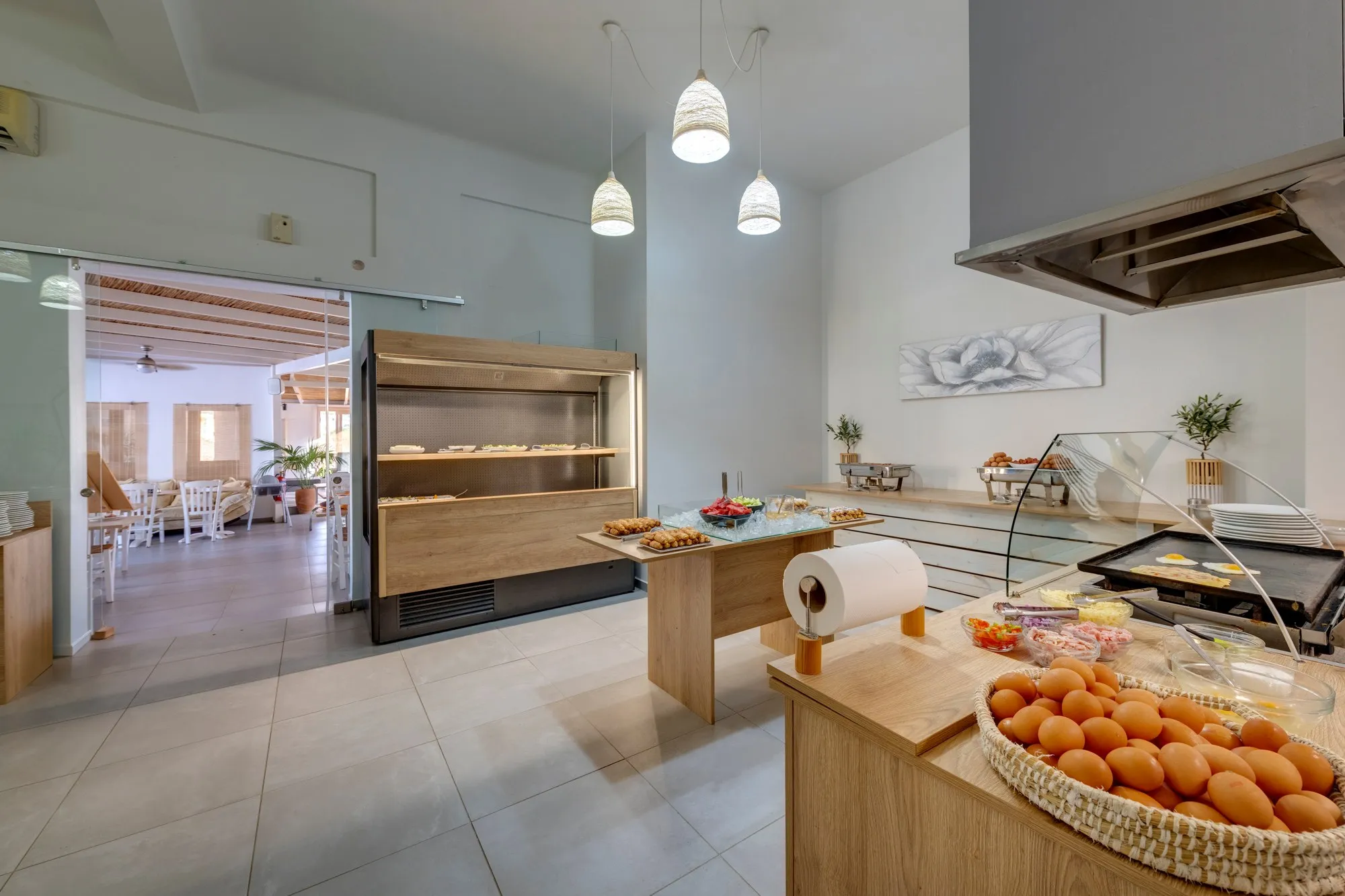 The breakfast room, with the buffet, a basket of fresh eggs and the dining room beyond